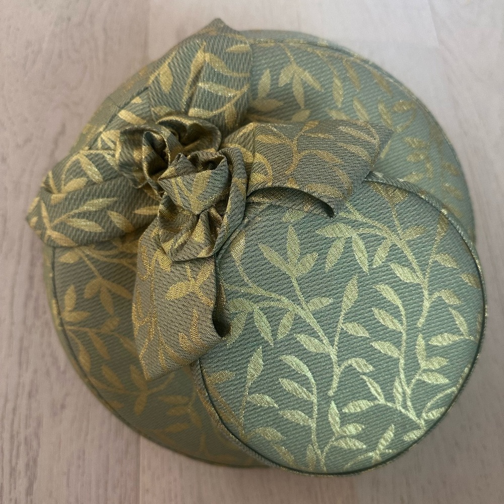 Elegant Green and Gold Hat